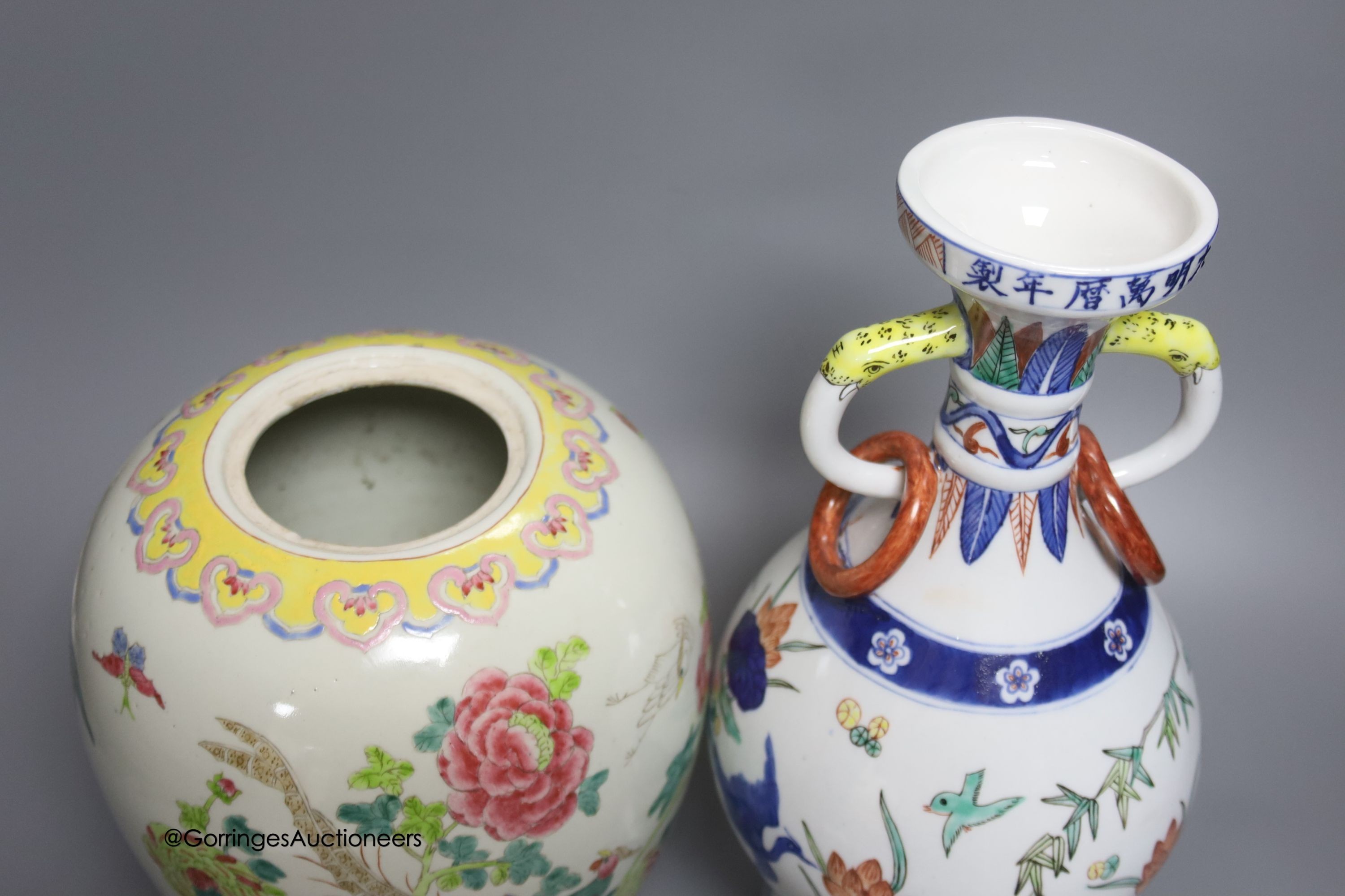 A Chinese famille rose jar and a polychrome vase, tallest 31cm